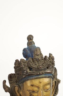 Lot 164 - AN EARLY GILT BRONZE TIBETAN BUDDHA