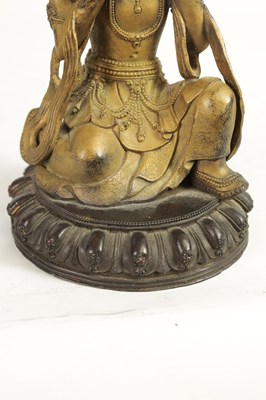 Lot 164 - AN EARLY GILT BRONZE TIBETAN BUDDHA
