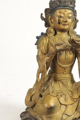 Lot 164 - AN EARLY GILT BRONZE TIBETAN BUDDHA