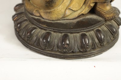 Lot 164 - AN EARLY GILT BRONZE TIBETAN BUDDHA