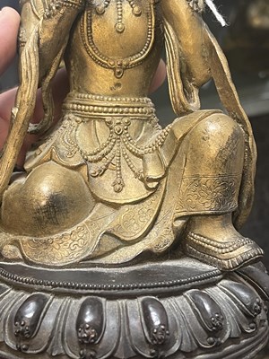 Lot 164 - AN EARLY GILT BRONZE TIBETAN BUDDHA