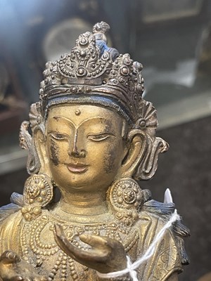 Lot 164 - AN EARLY GILT BRONZE TIBETAN BUDDHA
