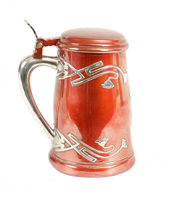 Lot 307 - AN AMERICAN ART NOUVEAU STERLING SILVER AND METAL LIDDED TANKARD