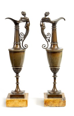 Lot 524 - A PAIR OF 19TH CENTURY BRONZE EWERS