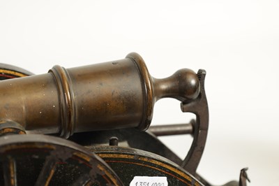 Lot 389 - A 19TH CENTURY BRONZE AND CAST IRON STARTING CANNON