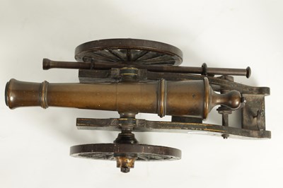 Lot 389 - A 19TH CENTURY BRONZE AND CAST IRON STARTING CANNON