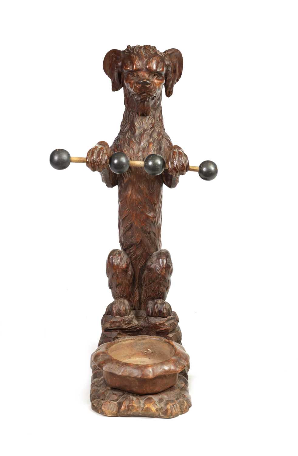 Lot 1130 - A 19TH-CENTURY BLACK FOREST CARVED WALNUT STICK STAND FORMED AS A BEGGING DOG