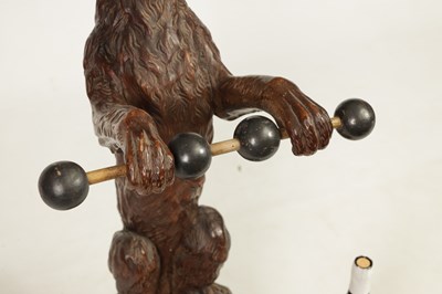 Lot 1130 - A 19TH-CENTURY BLACK FOREST CARVED WALNUT STICK STAND FORMED AS A BEGGING DOG