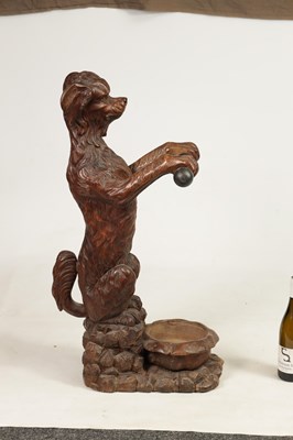 Lot 1130 - A 19TH-CENTURY BLACK FOREST CARVED WALNUT STICK STAND FORMED AS A BEGGING DOG