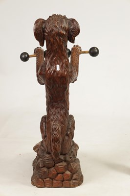 Lot 1130 - A 19TH-CENTURY BLACK FOREST CARVED WALNUT STICK STAND FORMED AS A BEGGING DOG