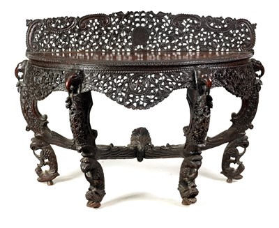 Lot 255 - A 19TH CENTURY ANGLO-INDIAN CARVED HARDWOOD DEMI LUNE SERVING TABLE