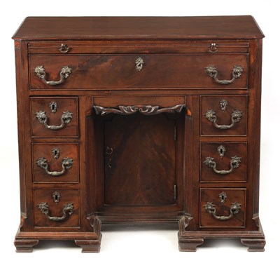 Lot 910 - A GEORGE III FIGURED MAHOGANY KNEEHOLE DESK