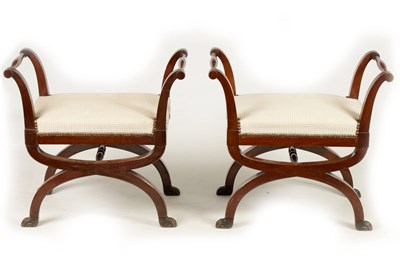 Lot 1019 - A PAIR OF 19TH CENTURY MAHOGANY X FRAMED UPHOLSTERED STOOLS