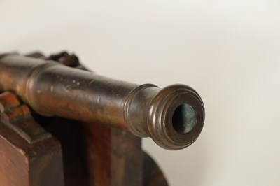 Lot 381 - AN 18TH/19TH CENTURY BRONZE STARTING CANNON