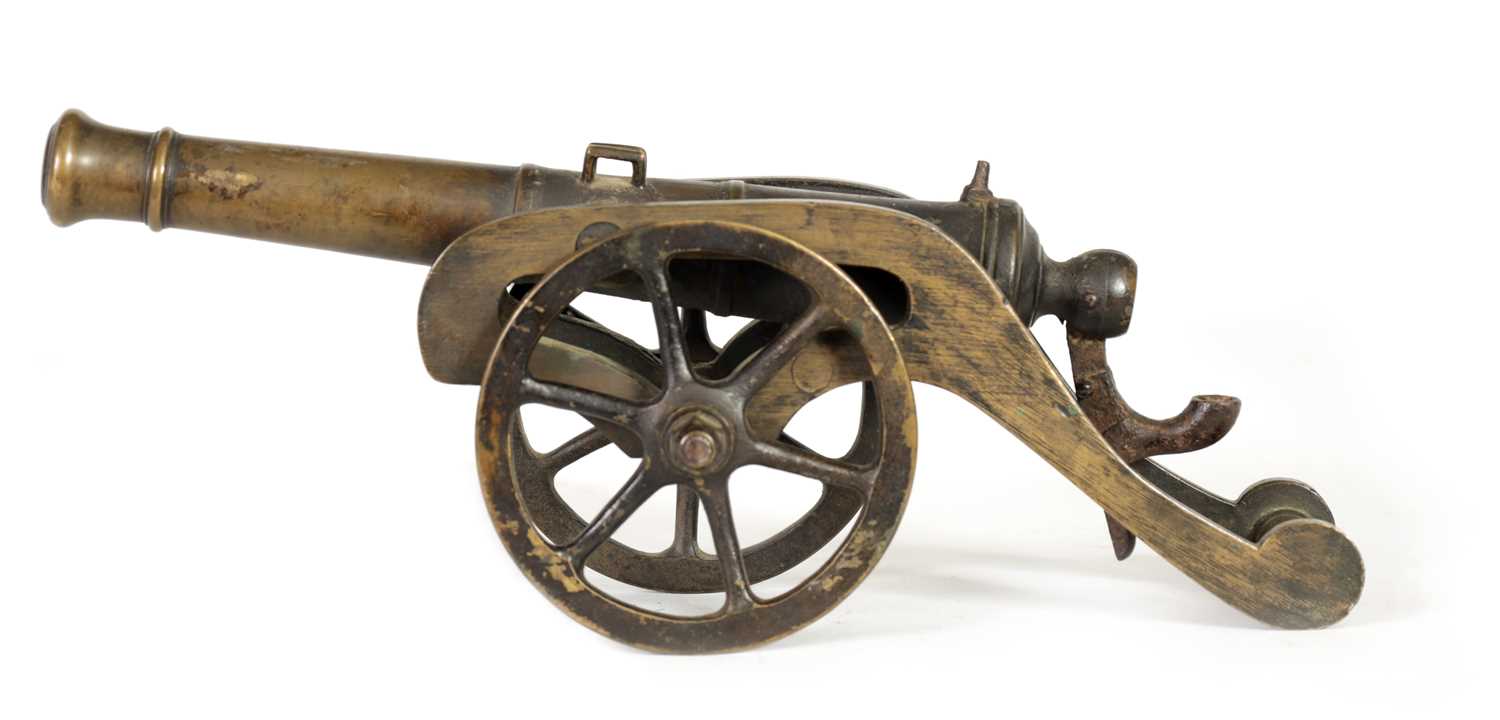 Lot 365 - A 19TH CENTURY BRONZE STARTING CANNON