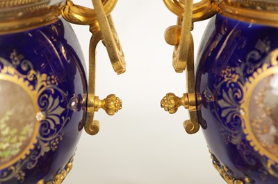 Lot 61 - A FINE PAIR OF 19TH CENTURY ORMOLU AND SEVRES PORCELAIN TWO HANDLED VASE AND COVERS
