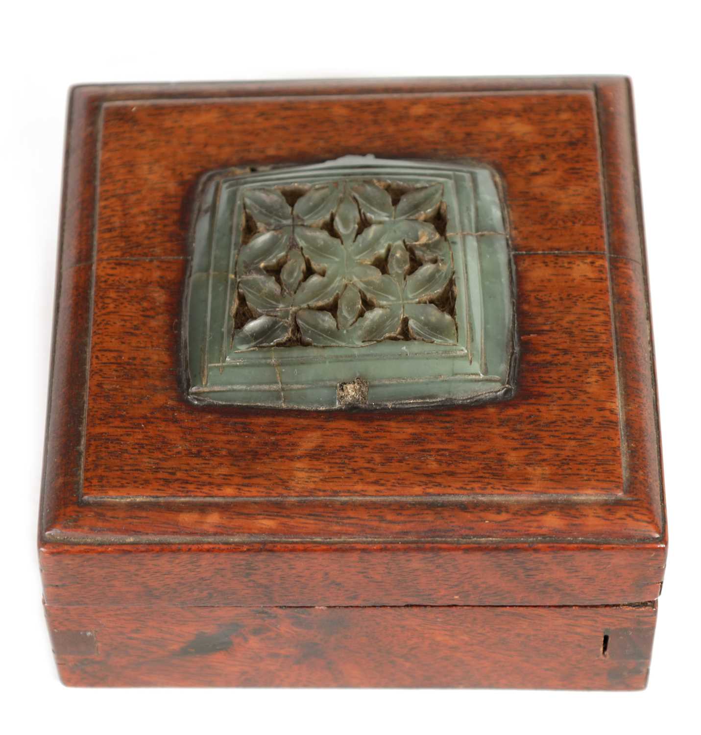 Lot 192 - AN EARLY CHINESE JADE PLAQUE MOUNTED ON LATER BOX