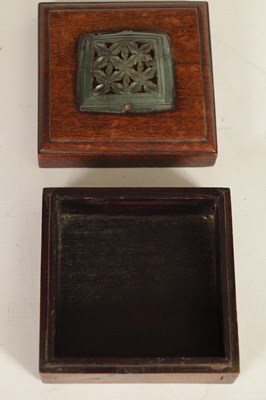 Lot 192 - AN EARLY CHINESE JADE PLAQUE MOUNTED ON LATER BOX