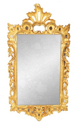 Lot 1072 - A GEORGE II STYLE CARVED GILT WOOD HANGING MIRROR