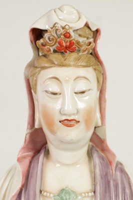 Lot 215 - A 19TH CENTURY CHINESE PORCELAIN GUAN YIN STATUE