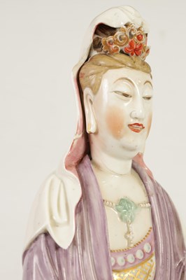 Lot 215 - A 19TH CENTURY CHINESE PORCELAIN GUAN YIN STATUE