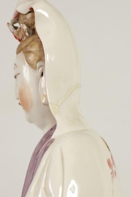 Lot 215 - A 19TH CENTURY CHINESE PORCELAIN GUAN YIN STATUE