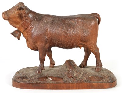 Lot 857 - A 19TH CENTURY SWISS CARVED LINDEN WOOD COW IN THE MANNER OF JOHANN HUGGLER