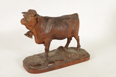 Lot 857 - A 19TH CENTURY SWISS CARVED LINDEN WOOD COW IN THE MANNER OF JOHANN HUGGLER