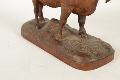 Lot 857 - A 19TH CENTURY SWISS CARVED LINDEN WOOD COW IN THE MANNER OF JOHANN HUGGLER