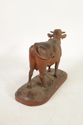 Lot 857 - A 19TH CENTURY SWISS CARVED LINDEN WOOD COW IN THE MANNER OF JOHANN HUGGLER