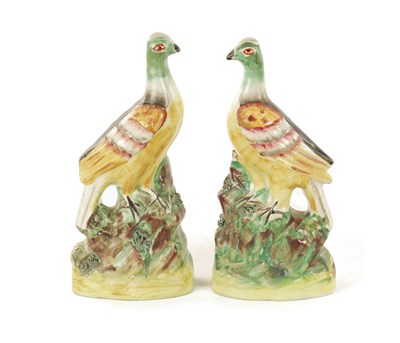 Lot 26 - A PAIR OF 19TH CENTURY STAFFORDSHIRE FIGURES
