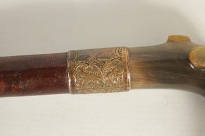 Lot 453 - TWO 19TH CENTURY CARVED HORN-HANDLED WALKING STICKS.