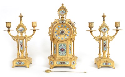Lot 791 - A LATE 19TH CENTURY FRENCH GILT METAL AND CHAMPLEVE ENAMEL CLOCK GARNITURE