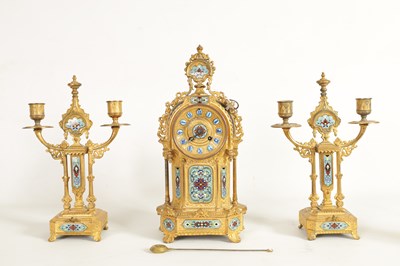 Lot 791 - A LATE 19TH CENTURY FRENCH GILT METAL AND CHAMPLEVE ENAMEL CLOCK GARNITURE