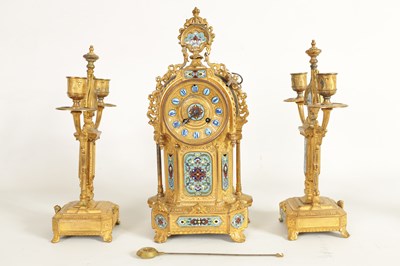 Lot 791 - A LATE 19TH CENTURY FRENCH GILT METAL AND CHAMPLEVE ENAMEL CLOCK GARNITURE