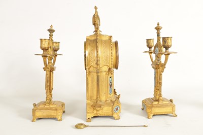 Lot 791 - A LATE 19TH CENTURY FRENCH GILT METAL AND CHAMPLEVE ENAMEL CLOCK GARNITURE