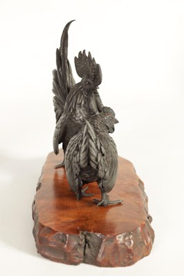 Lot 209 - A JAPANESE MEIJI PATINATED BRONZE SCULPTURE ON HARDWOOD BASE