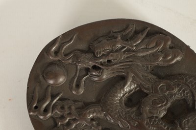 Lot 147 - A CHINESE DRAGON INKSTONE