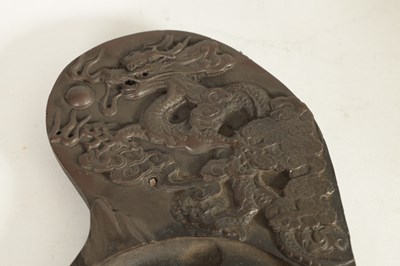 Lot 147 - A CHINESE DRAGON INKSTONE