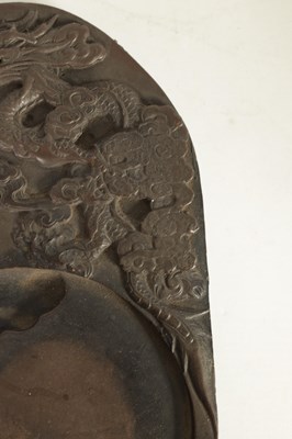 Lot 147 - A CHINESE DRAGON INKSTONE