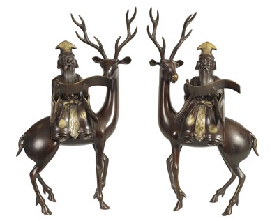 Lot 119 - A LARGE PAIR OF LATE 19TH CENTURY PATINATED BRONZE KOROS