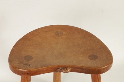 Lot 856 - A ROBERT ‘MOUSEMAN’ THOMPSON LIGHTLY ADZED OAK MILKING STOOL