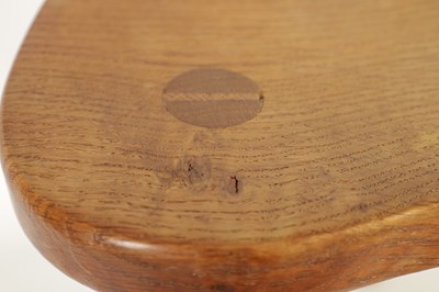 Lot 856 - A ROBERT ‘MOUSEMAN’ THOMPSON LIGHTLY ADZED OAK MILKING STOOL