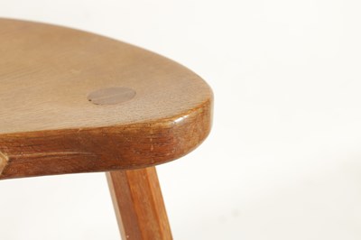 Lot 856 - A ROBERT ‘MOUSEMAN’ THOMPSON LIGHTLY ADZED OAK MILKING STOOL