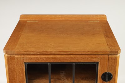 Lot 847 - AN UNUSUAL ROBERT ‘MOUSEMAN’ THOMPSON JOINED ADZED LIGHT OAK  MUSIC CABINET/CENTRE