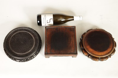 Lot 131 - A COLLECTION OF THREE CHINESE HARDWOOD VASE STANDS
