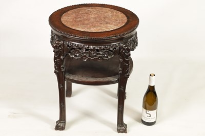 Lot 244 - A 19TH CENTURY PROFUSELY CARVED CHINESE HARDWOOD CIRCULAR JARDINIERE STAND