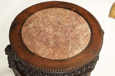 Lot 244 - A 19TH CENTURY PROFUSELY CARVED CHINESE HARDWOOD CIRCULAR JARDINIERE STAND