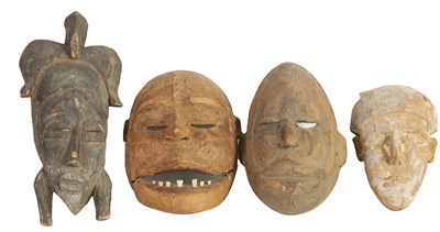 Lot 168 - A COLLECTION OF FOUR TRIBAL AFRICAN FACE MASKS