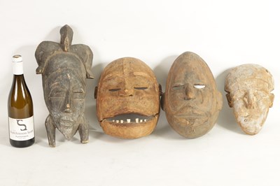 Lot 168 - A COLLECTION OF FOUR TRIBAL AFRICAN FACE MASKS